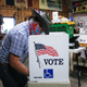 A voter marks his ballot at a polling place in Dennis Wilkening’s shed on November 3, 2020 in Richland, Iowa